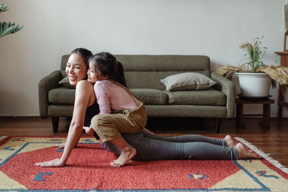 Mom and daughter practicing yoga and mindfulness together